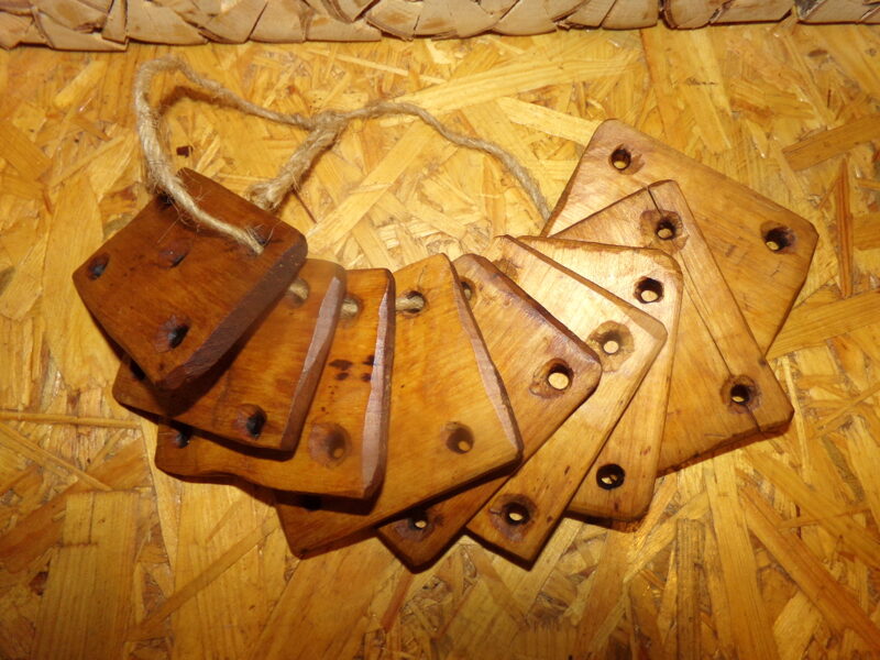 №166. Девять деревянных пластин с отверстиями. Восточная Латвия. Начало 20 века.